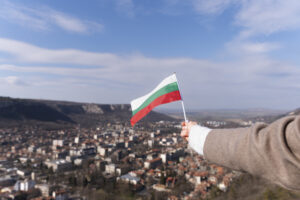 female-hand-holding-fabric-flag-bulgaria