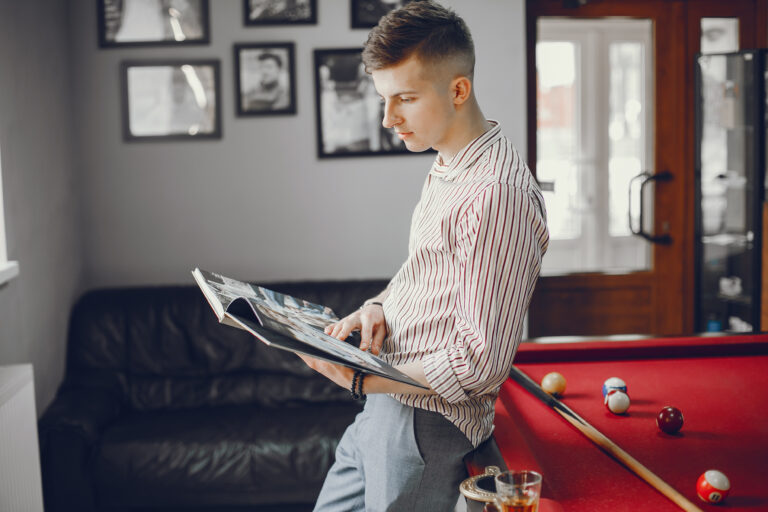 A nice guy playing a billiard